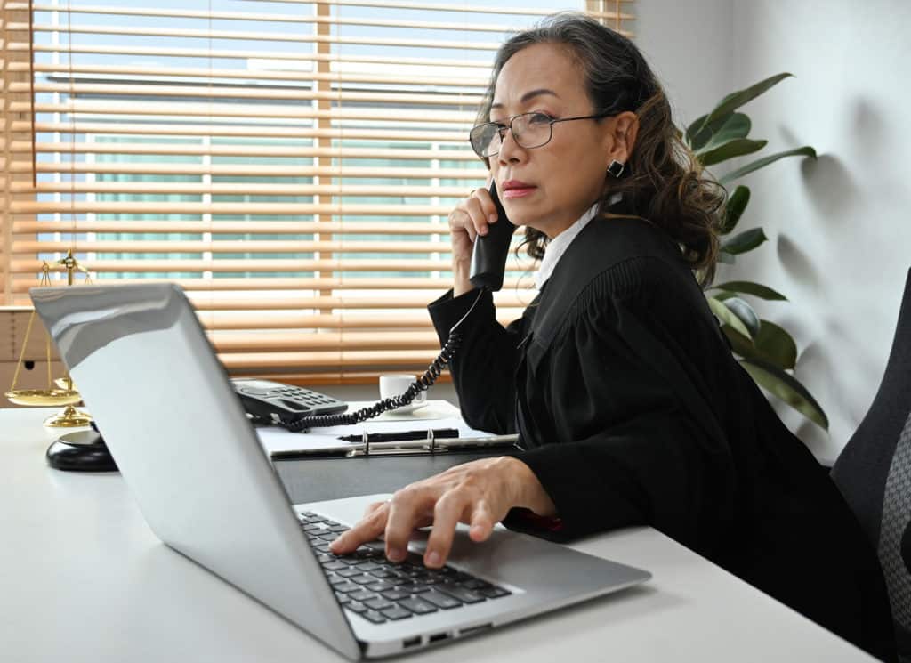 Female lawyer giving a consultation online at home